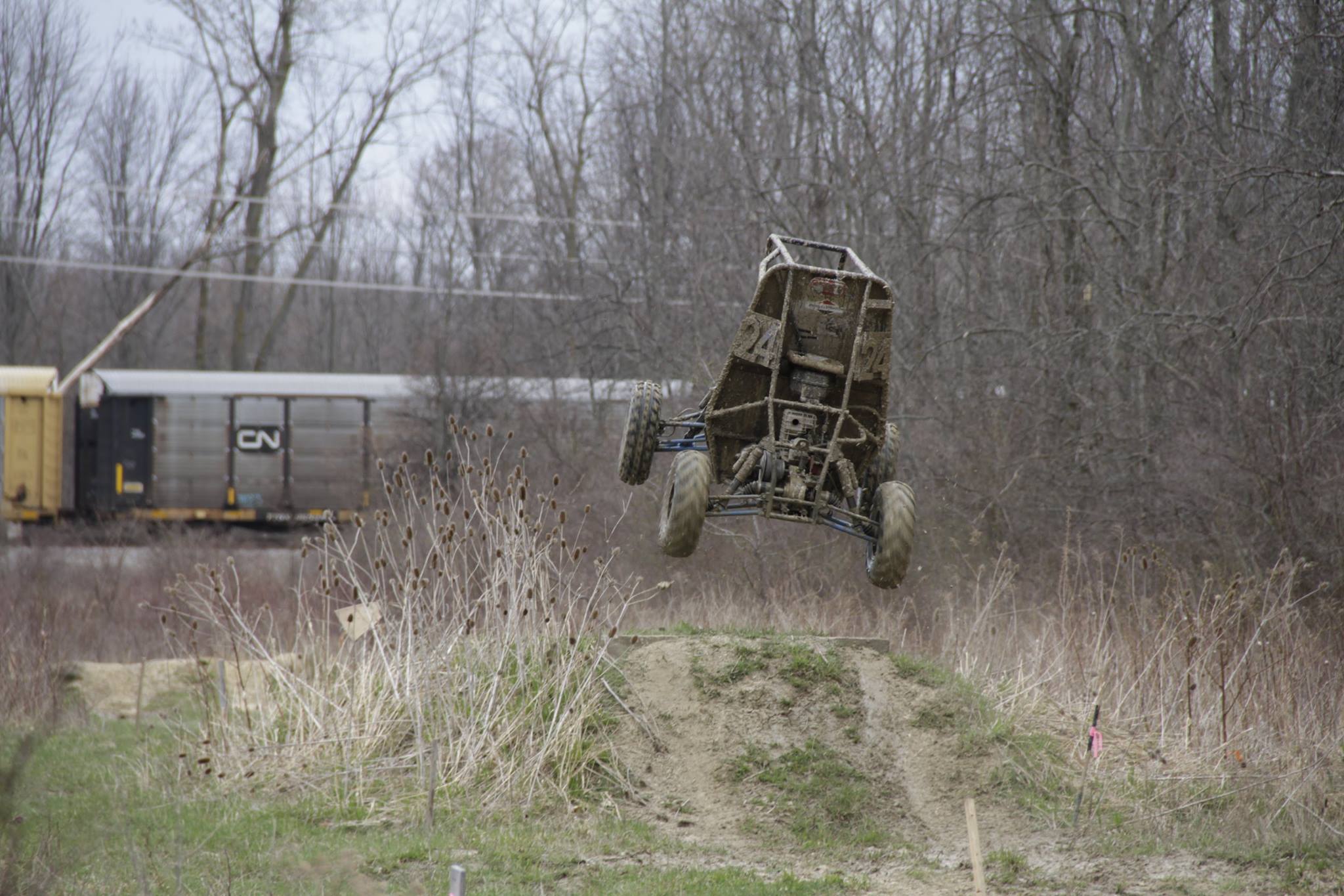 Image of the baja car getting way too much air time.